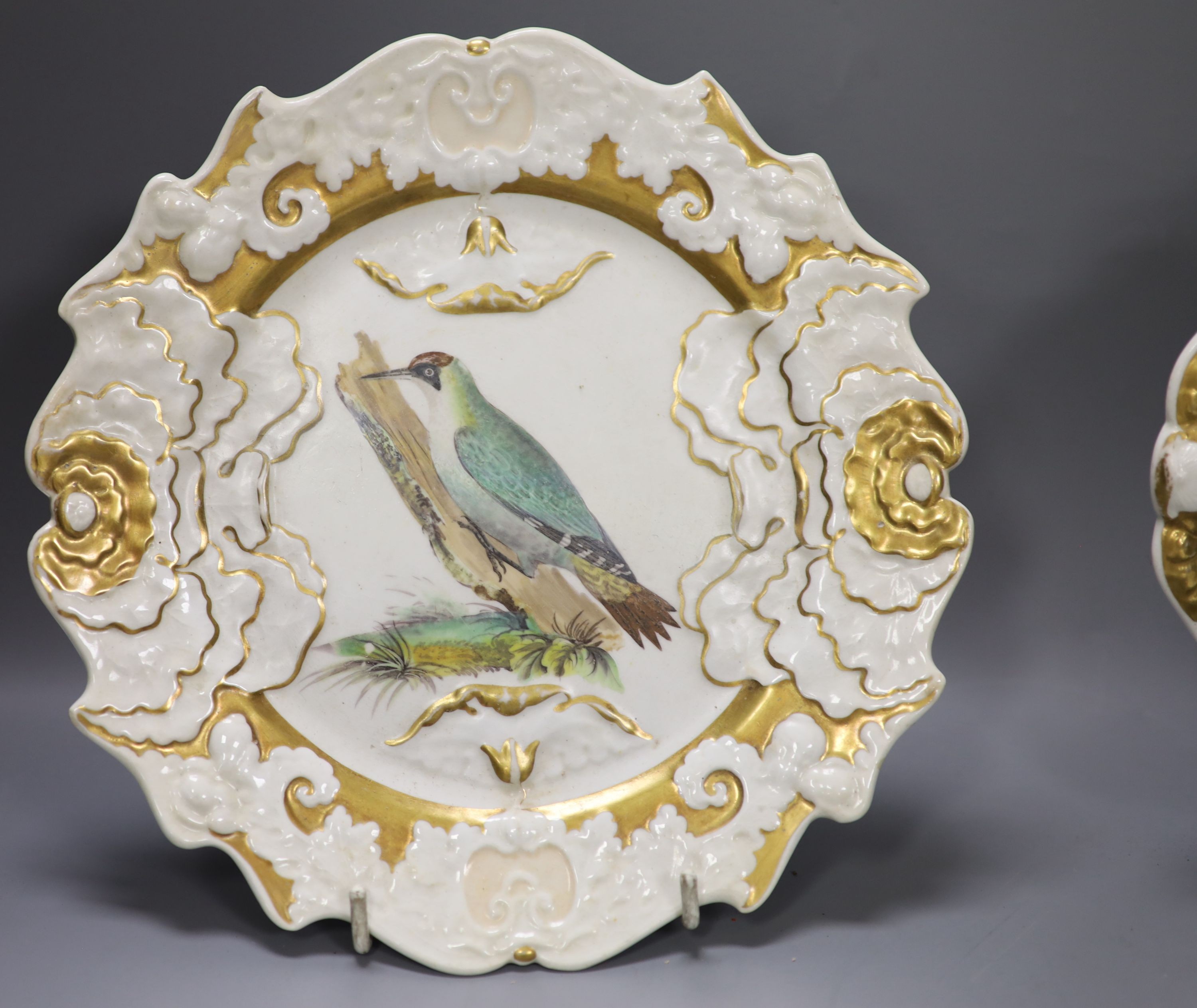 Four French faience plates and three Mason’s Cambrian Argil dishes and to early 19th century English porcelain ornithological dishes